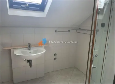Bathroom with a washbasin and a shower cabin in the attic. - image 12