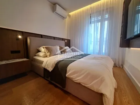 Modern bedroom with a double bed and wooden wall paneling. - image 9