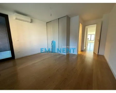 Empty bedroom with a fitted wardrobe and wooden flooring. - image 7