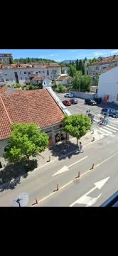 View from the terrace onto the street and urban neighborhood. - image 2