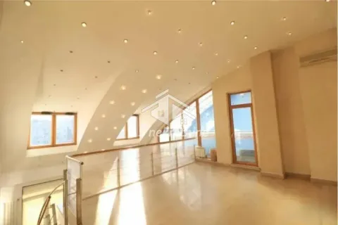 Spacious bright attic living room with an upper gallery level and recessed ceiling lighting. - image 10