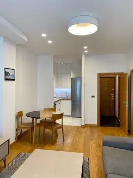 Living room with dining area and view of the kitchen. - image 4