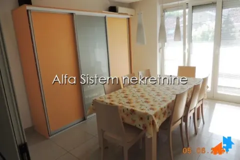 Dining area with a table, chairs, and a large wardrobe in an apartment. - image 21