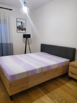 Furnished bedroom with a double bed and a nightstand. - image 7