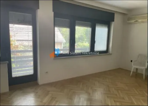 Empty room with parquet flooring, windows, and a door leading to the terrace. - image 3