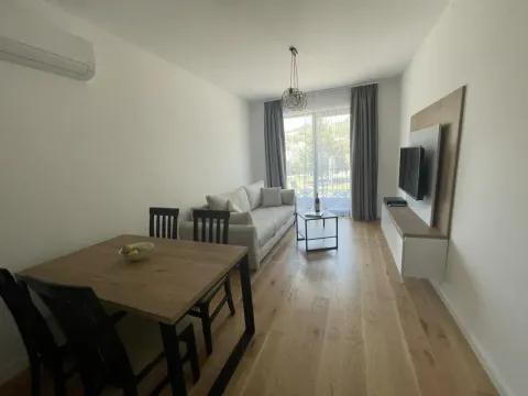 Bright living room with dining area and access to the terrace. - image 4
