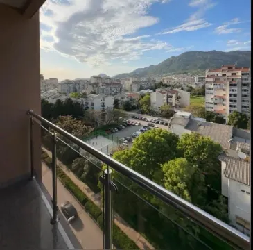 View of the city and mountains from the balcony. - image 9