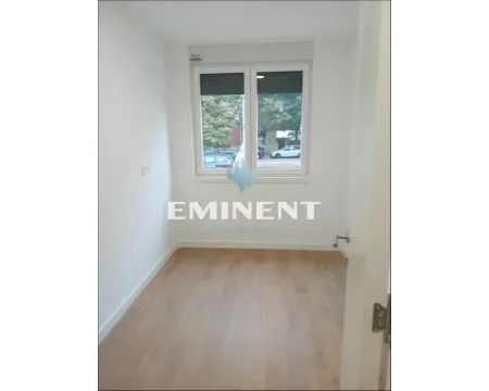 Empty room with a window and wooden flooring. - image 5