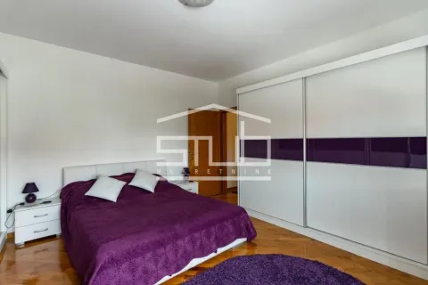 Bedroom with a double bed, large wardrobe and bedside tables. - image 2