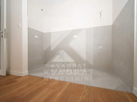 Part of the kitchen with prepared connections and ceramic wall tiles. - image 2