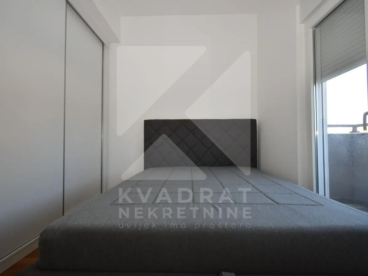 Bedroom with a double bed and a built-in wardrobe.