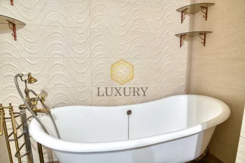 Bathroom with bathtub and retro faucets. - image 17
