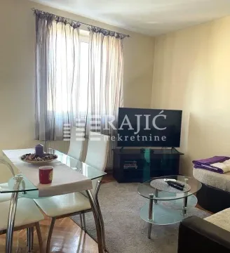 Living room with a dining area and seating set. - image 3