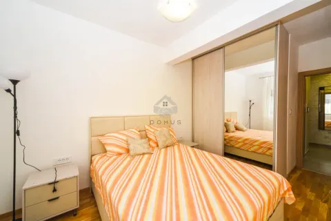 Bedroom with a double bed and a fitted wardrobe with a mirror. - image 7