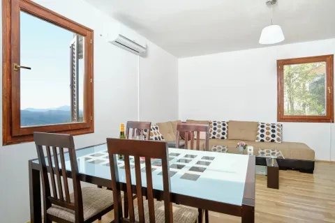 Living room with a dining area, wooden table and sofa set. - image 6