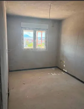 Unfurnished room in rough construction phase with a window. - image 6