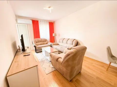 Living room with sofa set, television, and dining chair. - image 3