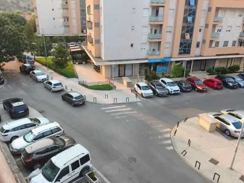 View from the window of the street and parking lot in front of the residential building. - image 4
