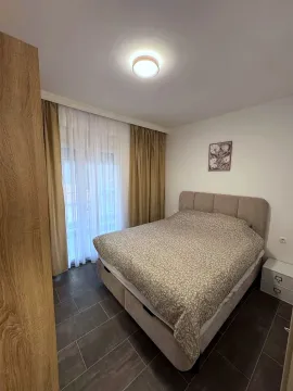 Furnished bedroom with a double bed and access to the terrace. - image 11