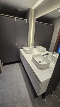 Modern washbasins with a large mirror in the bathroom. - image 12