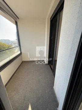 Unfurnished balcony space with a glass railing and a view of the surroundings. - image 15