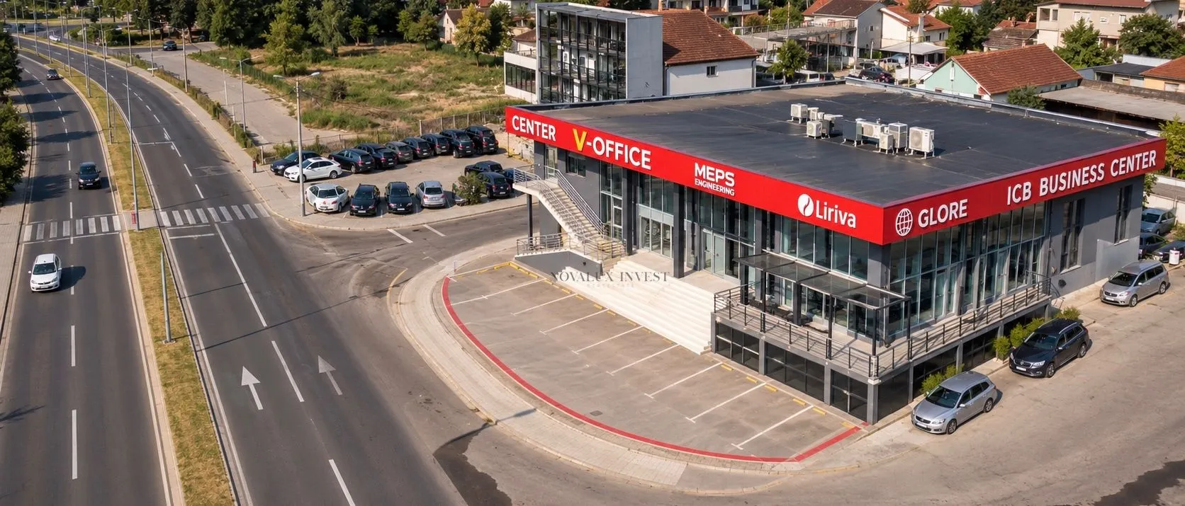 Aerial view of the business center with parking and surrounding roads.