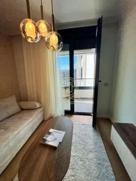 Dnevna soba sa garniturom, stočićem i izlazom na terasu. - image 3