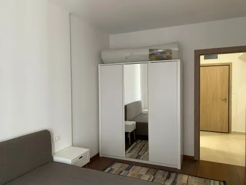 Furnished bedroom with a white wardrobe and a double bed. - image 4