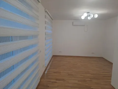 Empty room with parquet flooring, white walls, and window blinds. - image 3