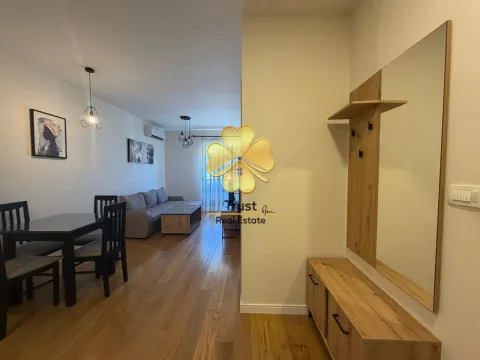Living room with dining area and hallway in a modern apartment. - image 6