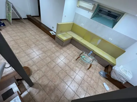 Living room with a corner bench and a glass coffee table. - image 7