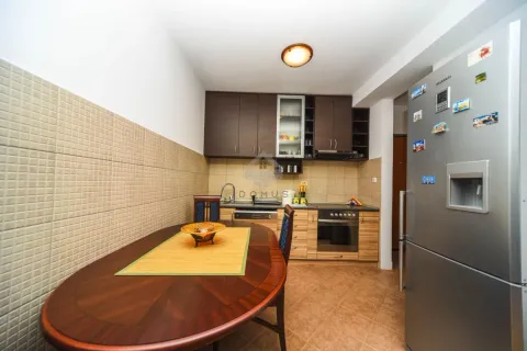 Kitchen with dining table and refrigerator. - image 3