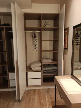 Open wardrobe with shelves and drawers in the bedroom. - image 20