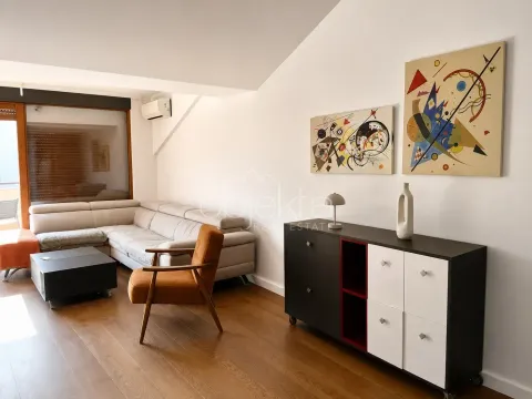 Living room with a sofa, armchair, and chest of drawers. - image 4