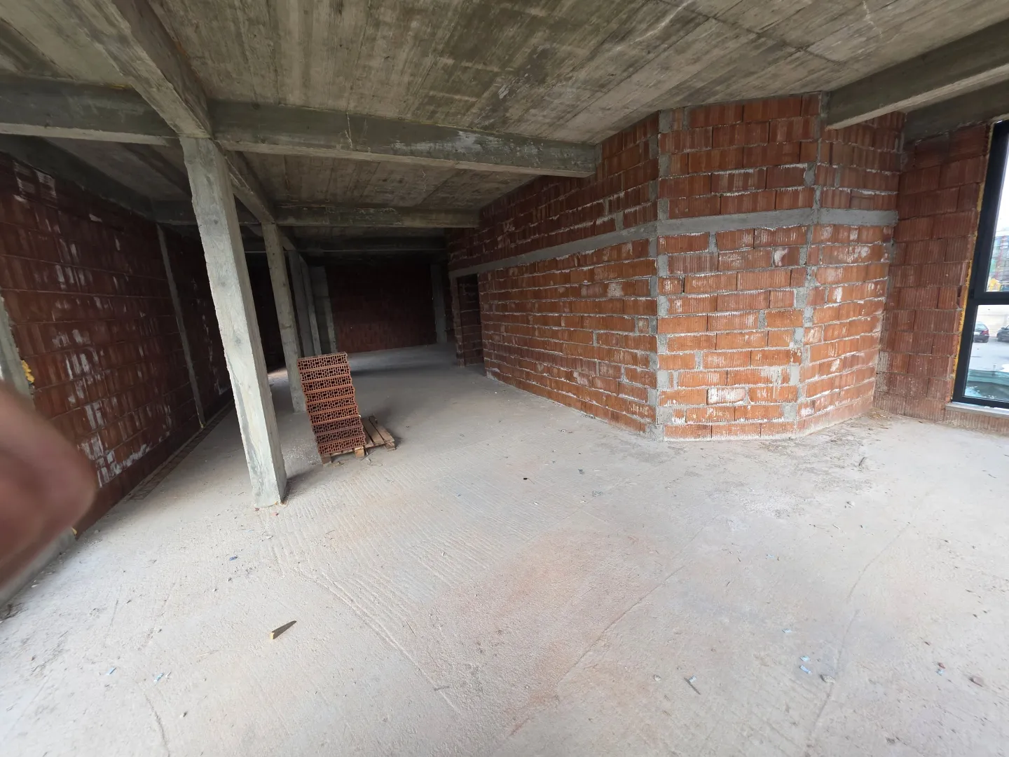 View of an unfinished space under construction with rough work.