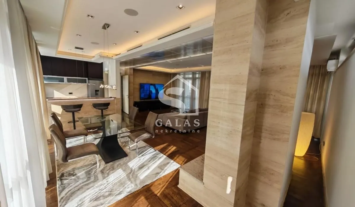 Spacious living room with a dining area and an open view of the kitchen.