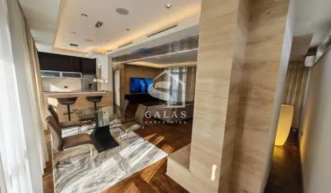 Spacious living room with a dining area and an open view of the kitchen. - image 5