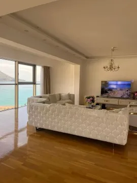 Spacious living room with a sofa set and a sea view. - image 18