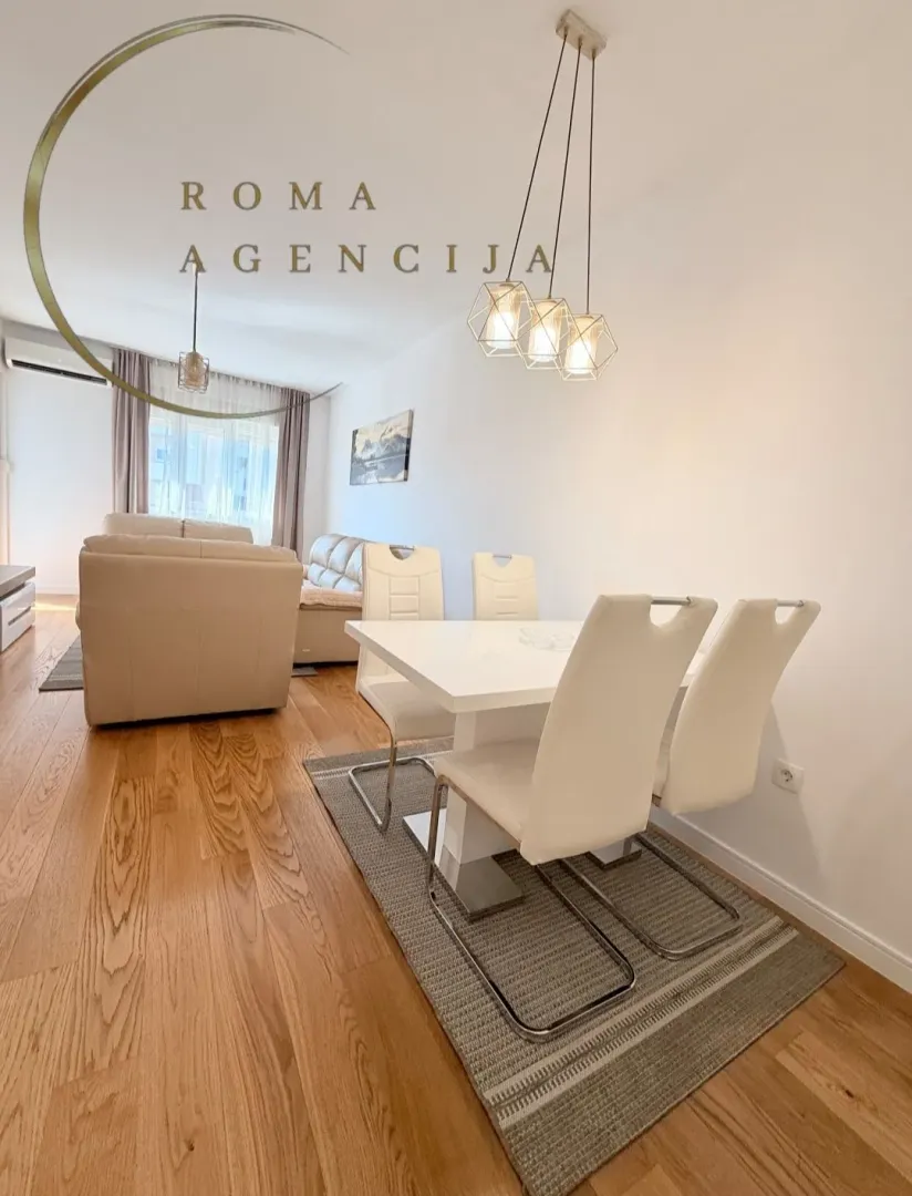 Living room with a dining area and seating furniture.