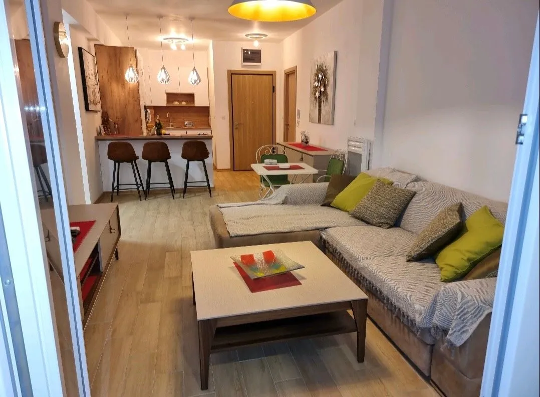 Living room connected to the dining area and kitchen.