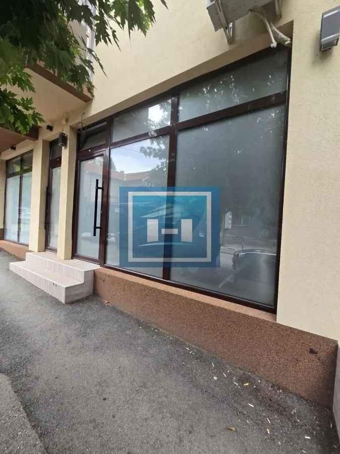 View of the exterior of the commercial space with a large storefront.