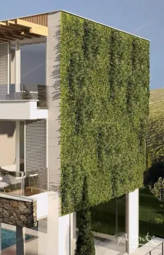 Pogled na spoljašnjost zgrade sa vertikalnom baštom i balkonima. - image 5