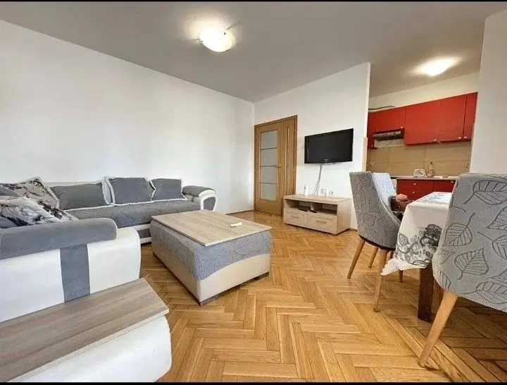 Living room connected to the dining area and kitchen.