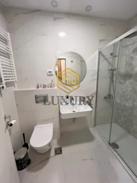 Modern bathroom equipped with a shower cabin. - image 7