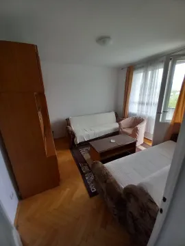 Living room with sofa set, wooden furniture and access to the terrace. - image 2