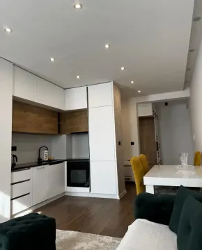 Living room with kitchen and dining area. - image 4