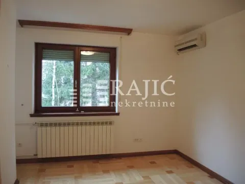 Empty room with a window, parquet flooring, and an air conditioner. - image 8