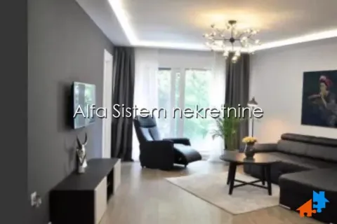 Moderan dnevni boravak sa garniturom i TV-om. - image 2