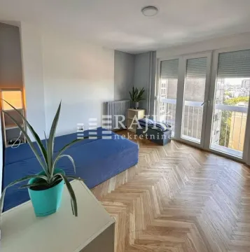 Furnished bedroom with a bed and access to the terrace. - image 10