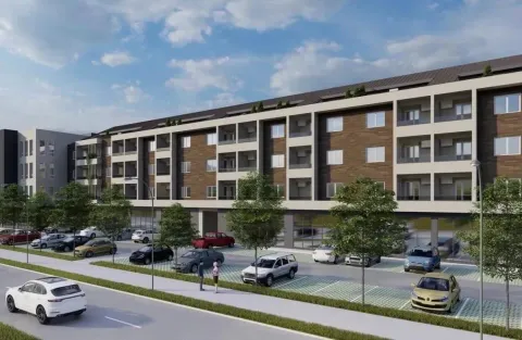 Exterior view of an apartment building with parking space in front. - image 3